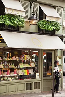 Leaving: Woman leaving Laduree Patisserie, Saint-Germain-des-Pres