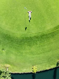 Resort: Woman lying on the green at the La Noria Golf Resort