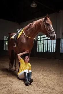 Saddle: Woman making a exercise in trust with a horse