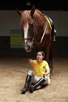 Saddle: Woman making a exercise in trust with a horse