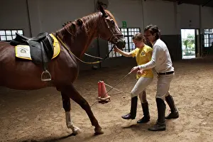Saddle: Woman making a exercise in trust with a horse