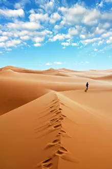 Model: Woman alone in the Sahara Desert, Erg Murzuq, Sahara