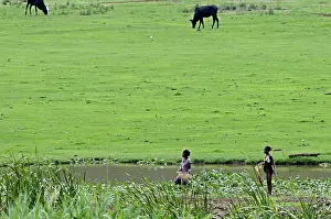Zones: Women fishing in a small river in Madagascar