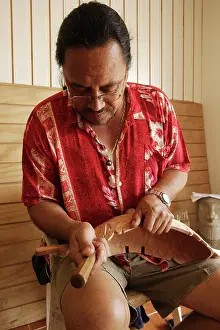 Luis: Wood carver Luis PatA, working on a carving of