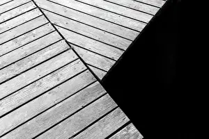 Pier: Detail of a wooden boardwalk pier over a lake in