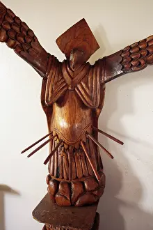 Township: Wooden figure combining angel with birdman in the