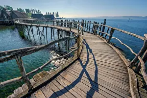 Typical: Wooden footbridge, pile dwellings on the shores