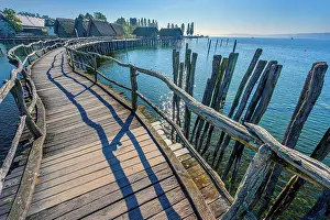 Typical: Wooden footbridge, pile dwellings on the shores