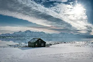 Timber: Wooden house in winter landscape, sea and mountains