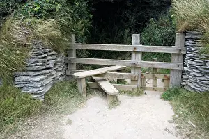Footpaths: Wooden stile with dog gate between stone walls