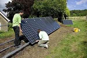Photovoltaic: Workers installing solar PV / photovoltaic panels