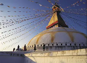 Decorated: Worshippers parade around the Great Stupa in the
