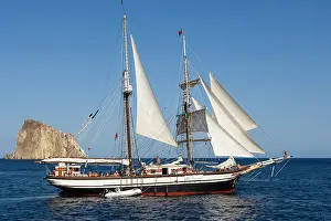 Ships: Yacht sailing off Isola Dattilo, volcanic island