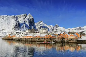 Cabin: Yellow rorbuer in winter, fishermens huts, snow-capped