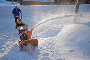 Blower: Young boy digging out from snow storm - using snow