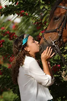 Halter: Young girl cuddling her horse - Senegal