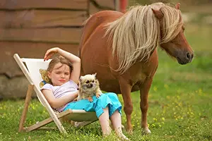 Deckchair: Young Girl - sitting in deckchair with dog and Shetland Pony
