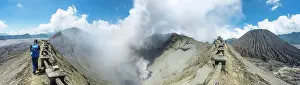 Java: Young man at the edge of the crater with view in