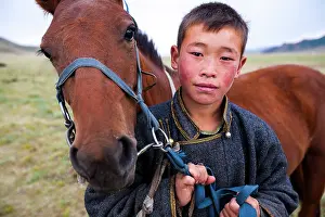 Steppes: Young Mongolian and his horse - Arkhangai Mongolia