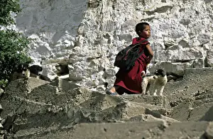 Monks: Young monk and dog Monastery Thiksey Leh India