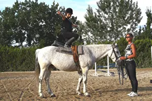 Exercise: Young rider performing an aerobatic exercise