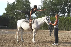 Exercise: Young rider performing an aerobatic exercise