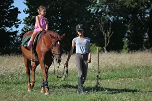Halter: Young Rider walking a girl riding - France