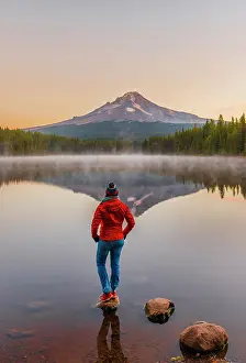 Hood: Young woman looking at view of volcano Mt. Hood