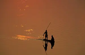 Luangwa: Zambia - Fishermen at sunset on the Luangwa river