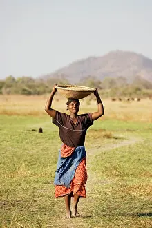 Millet: Zambia - Tonga woman carries a basket with millet