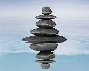 Cairn: Zen stones balance concept isolated on white