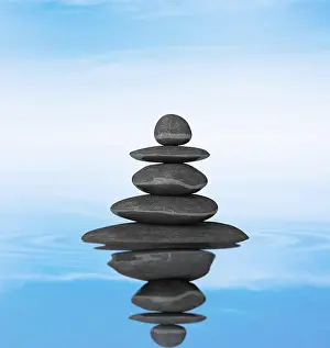 Cairn: Zen stones balance concept isolated on white