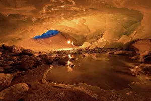 Valais: Zinal glacier cave, illuminated by man and torch